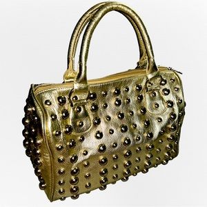 Gold studded faux leather handbag
